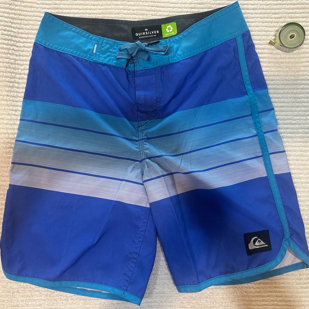 Like new condition Quiksilver board shorts turquoise / blue. Boys/Men’s Size 27”